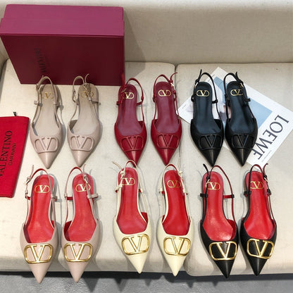 VLOGO SIGNATURE BLACK CALFSKIN FLAT SLINGBACK PUMP WITH GOLD LOGO