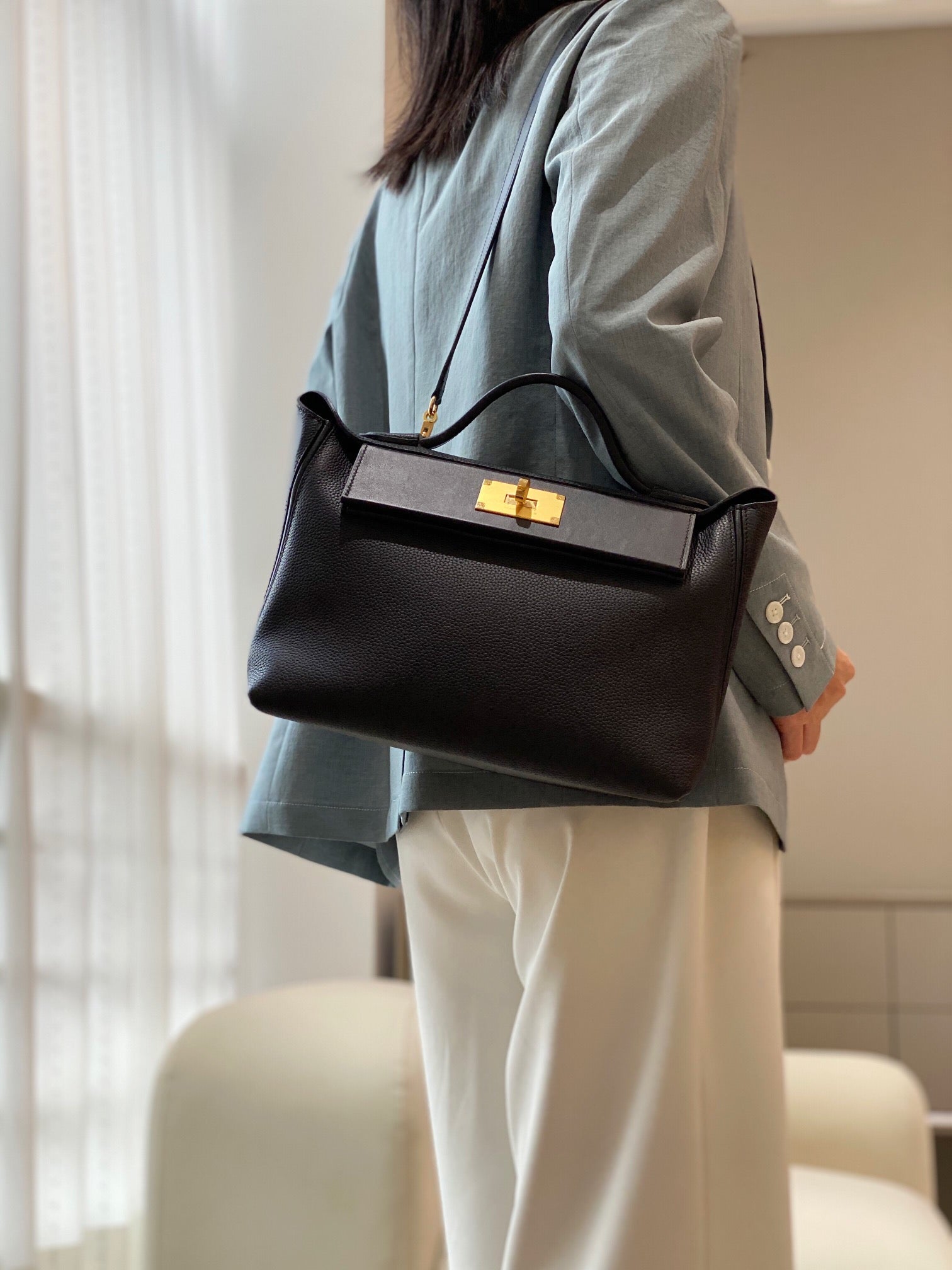 MINI 24/24 29CM IN BLACK EVERCOLOR CALFSKIN GOLD KELLY BUCKLE