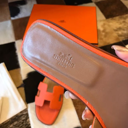 HERM Oran Slide Sandals In Orange Clemence Leather