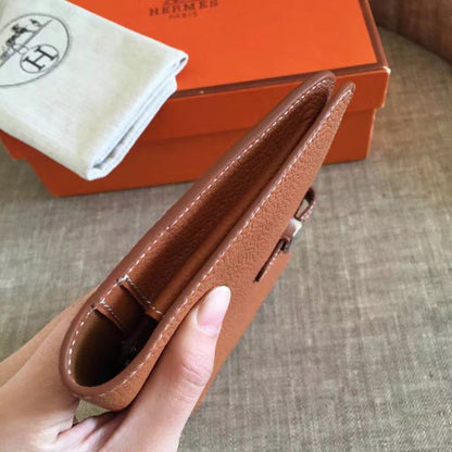 HERM Dogon Duo Wallet In Gold Clemence Leather