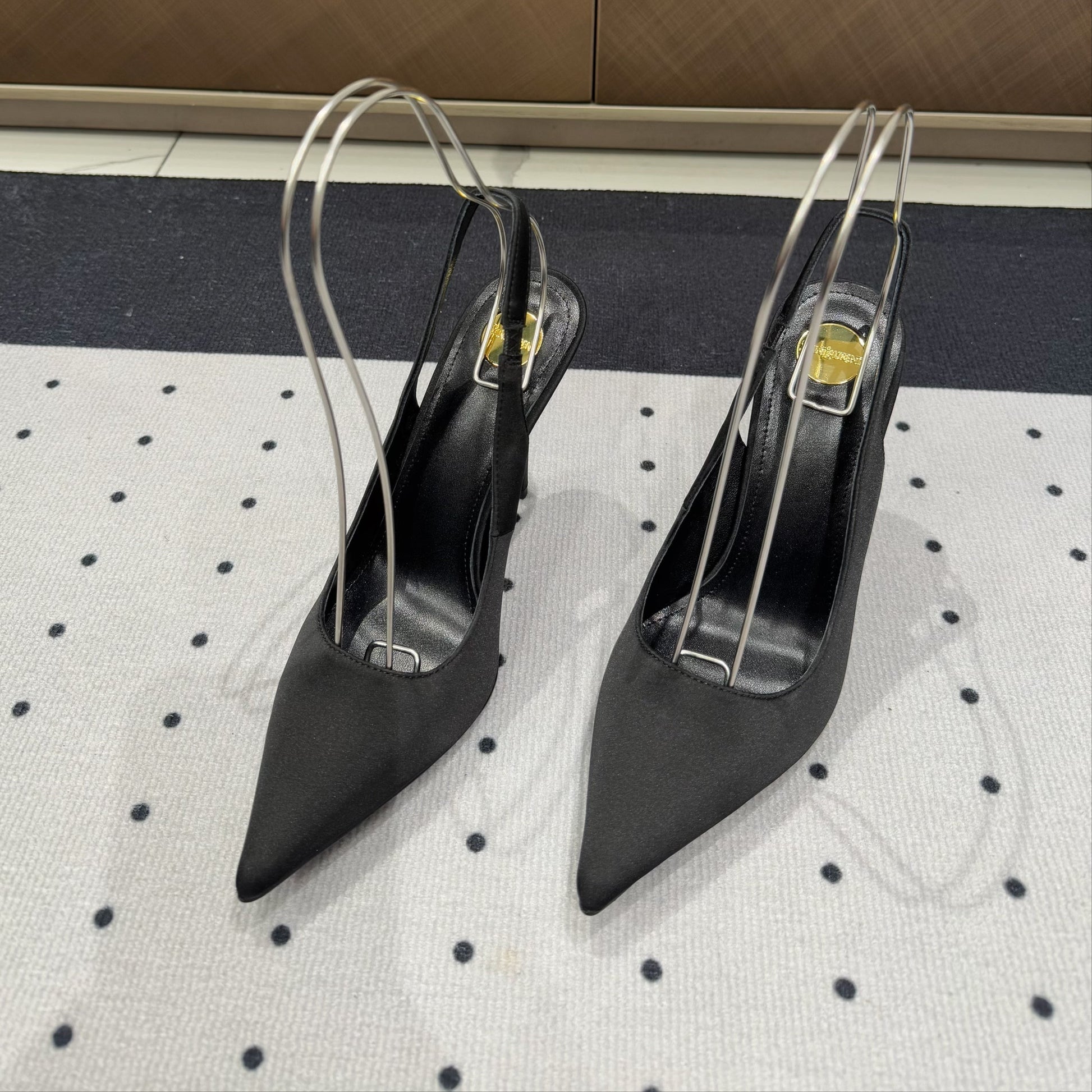 L'ENTRACTE SLINGBACK PUMPS IN BLACK SATIN