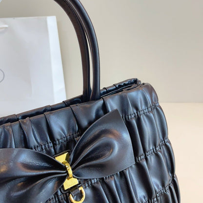 BOW DETAIL RUCHED TOP HANDLE BAG 29 IN BLACK SAFFIANO LEATHER