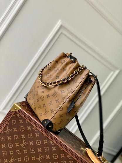 NOÉ TRUNK 23 IN BROWN MONOGRAM REVERSE CANVAS GOLD HARDWARE