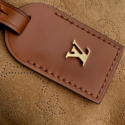 CARRYALL PM 29 IN CIDER BROWN MONOGRAM PERFORATED SUEDE AND WHITE SHEARLING TRIM
