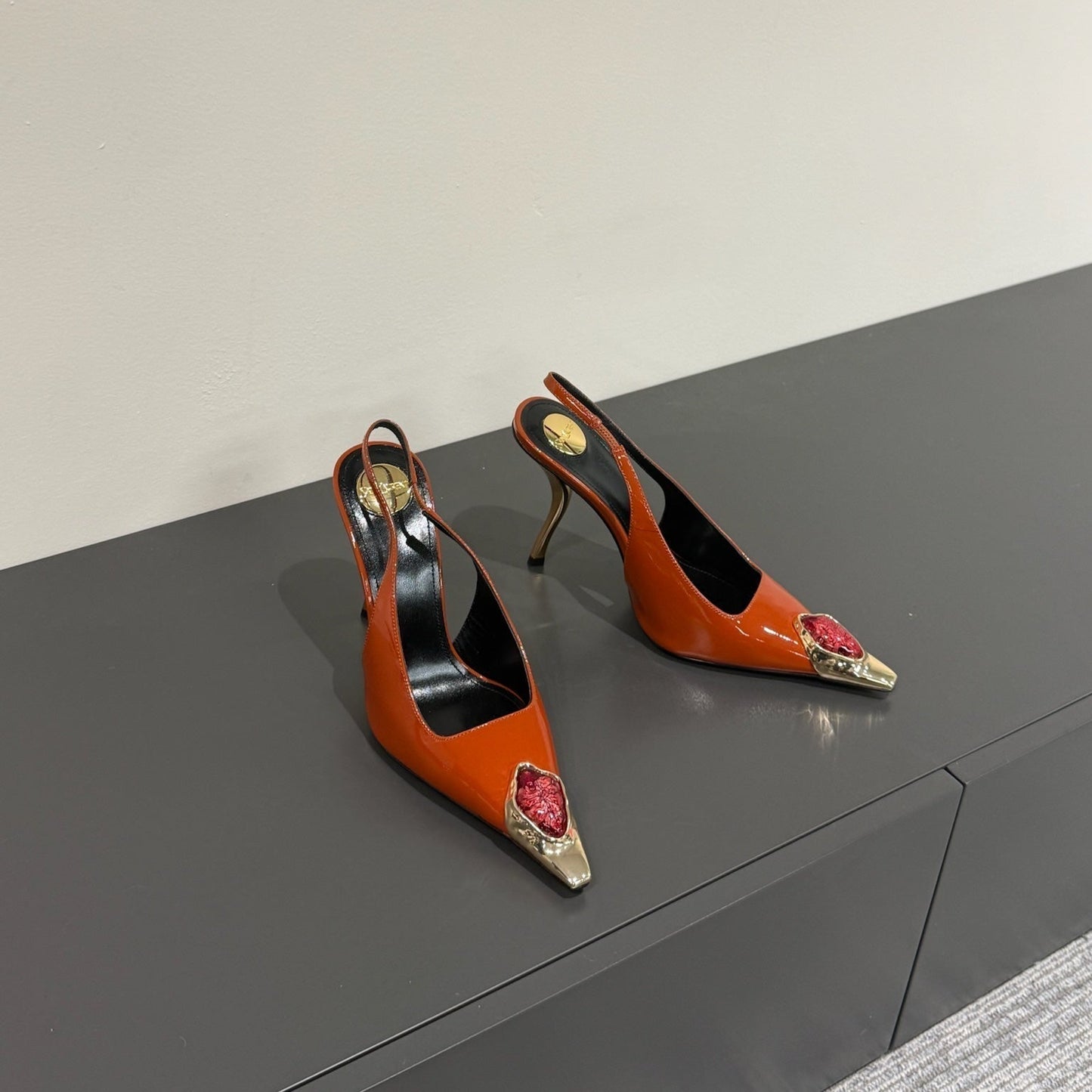 RED GEM-STUDDED SLINGBACK PUMPS IN ORANGE PATENT CALFSKIN