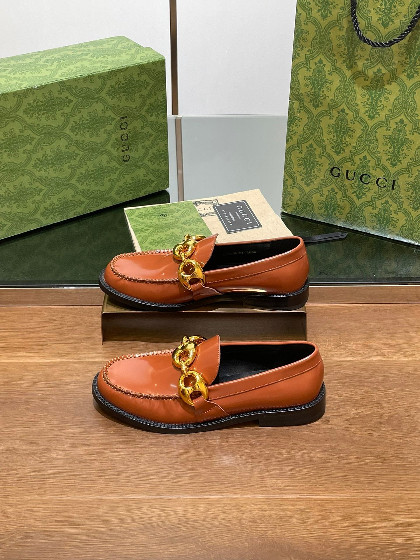 GG LOAFER SHOES IN BRONZE BROWN CALFSKIN WITH GOLD HARDWARE