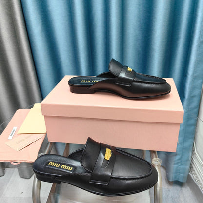 MULES SLIPPERS BLACK COWHIDE WITH GOLD COIN