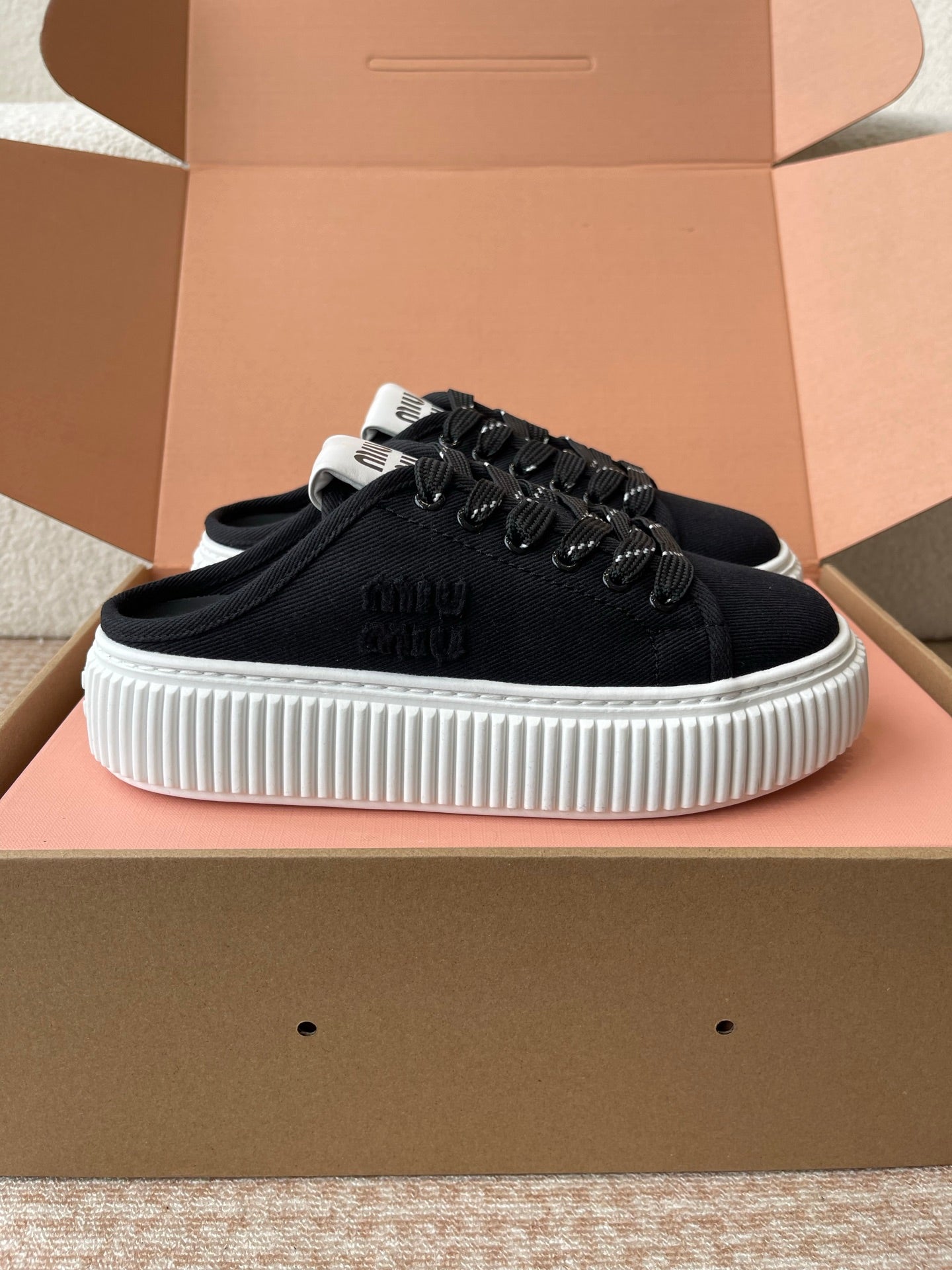 WASH SNEAKER MULES IN BLACK DENIM