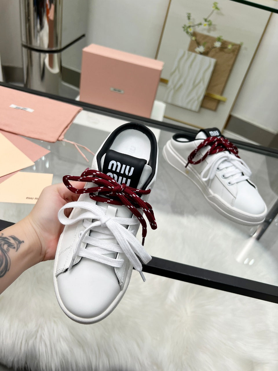 SNEAKER MULES IN BLACK AND WHITE CALFSKIN WHITE RED LACES